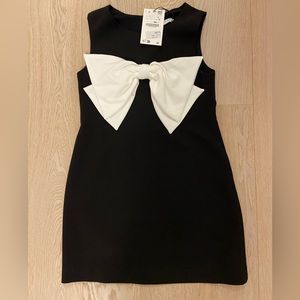 New with tags. Black dress with white bow